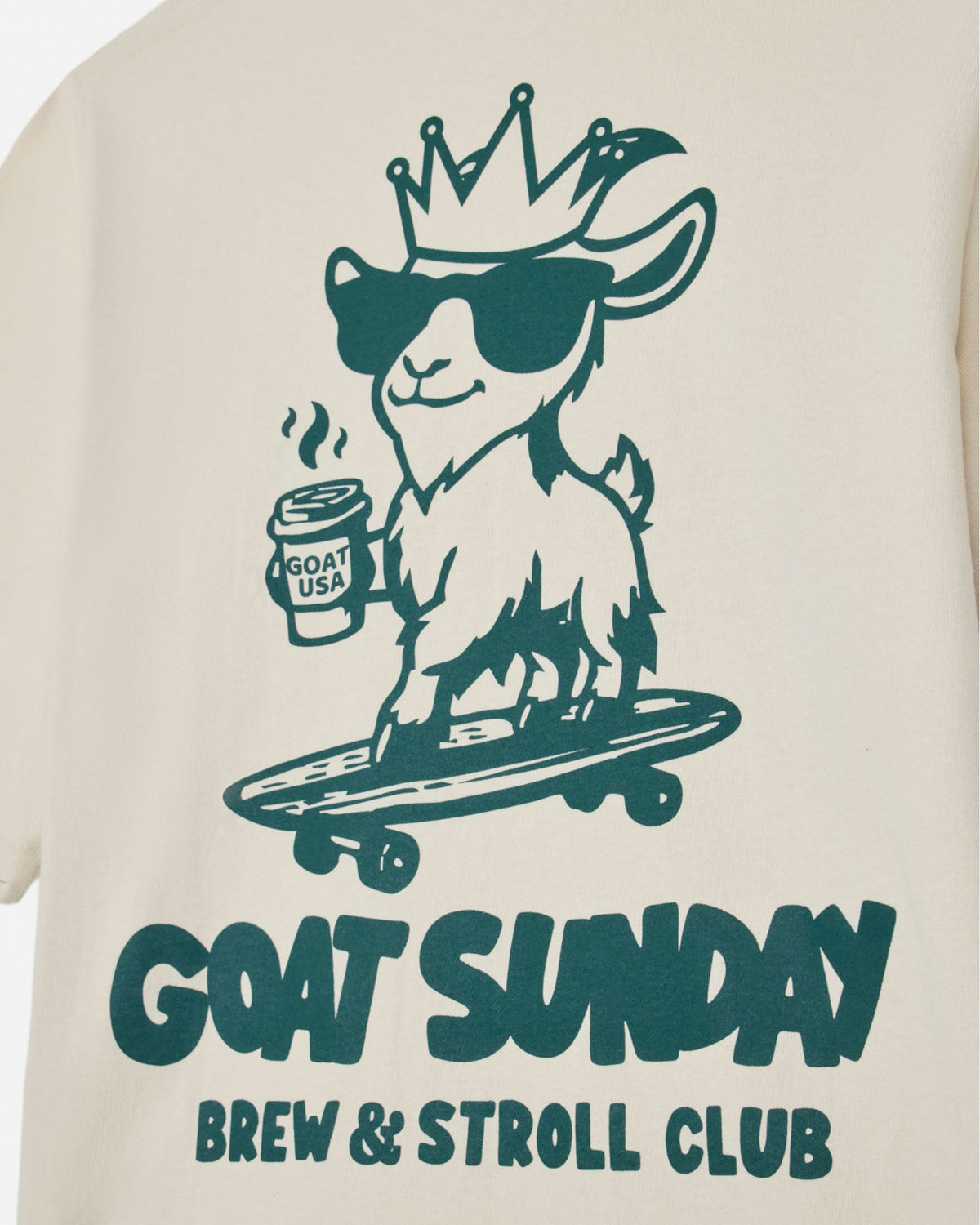 T-shirt with a graphic of a goat on a skateboard holding a coffee cup, with 'GOAT SUNDAY Brew & Stroll Club' text.