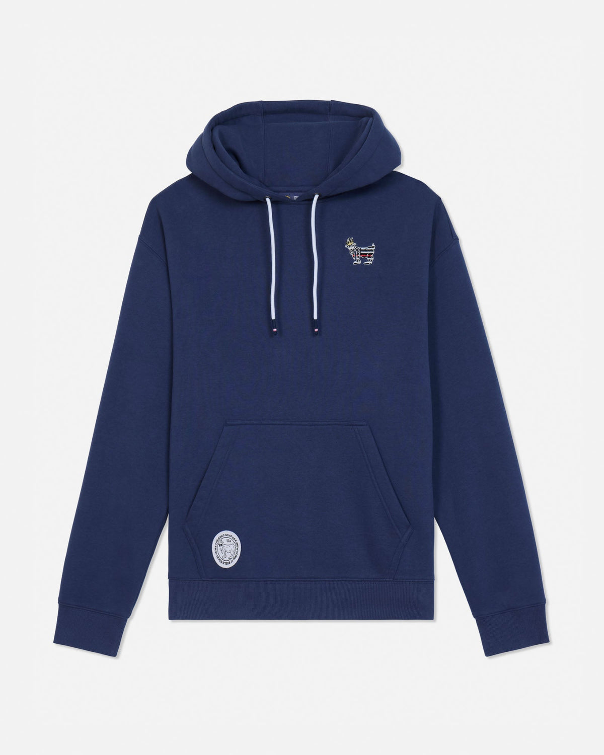 A navy blue pullover hoodie with white drawstrings, featuring a small embroidered graphic on the left chest and a circular patch on the lower left front pocket, displayed against a light gray background.