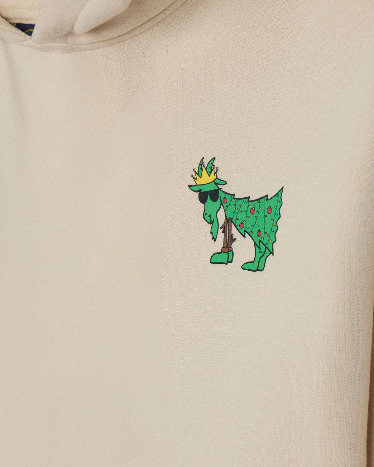 Beige hoodie with a green cartoon character wearing a crown on a beige background