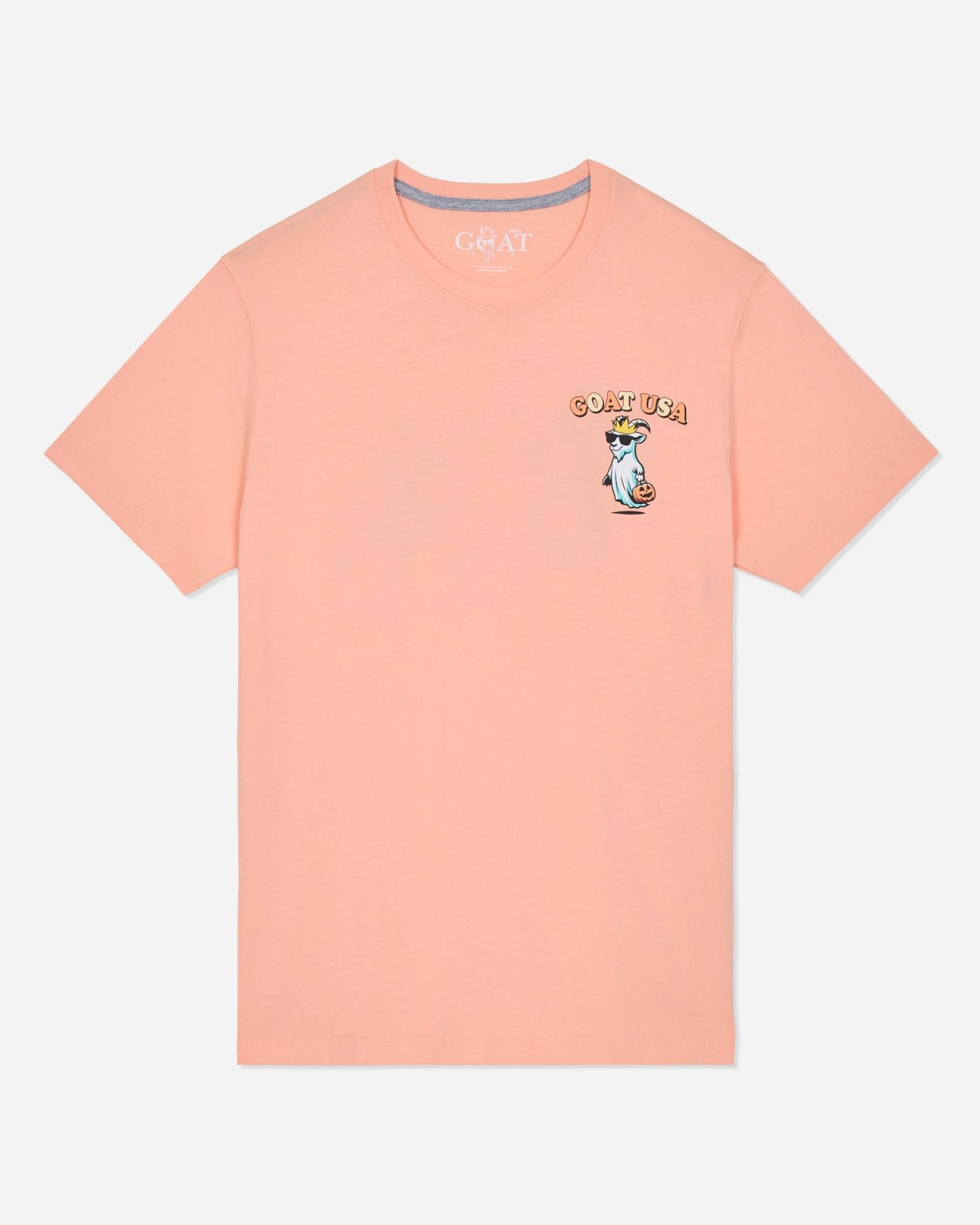 Peach-colored t-shirt with a graphic design on a light gray background
