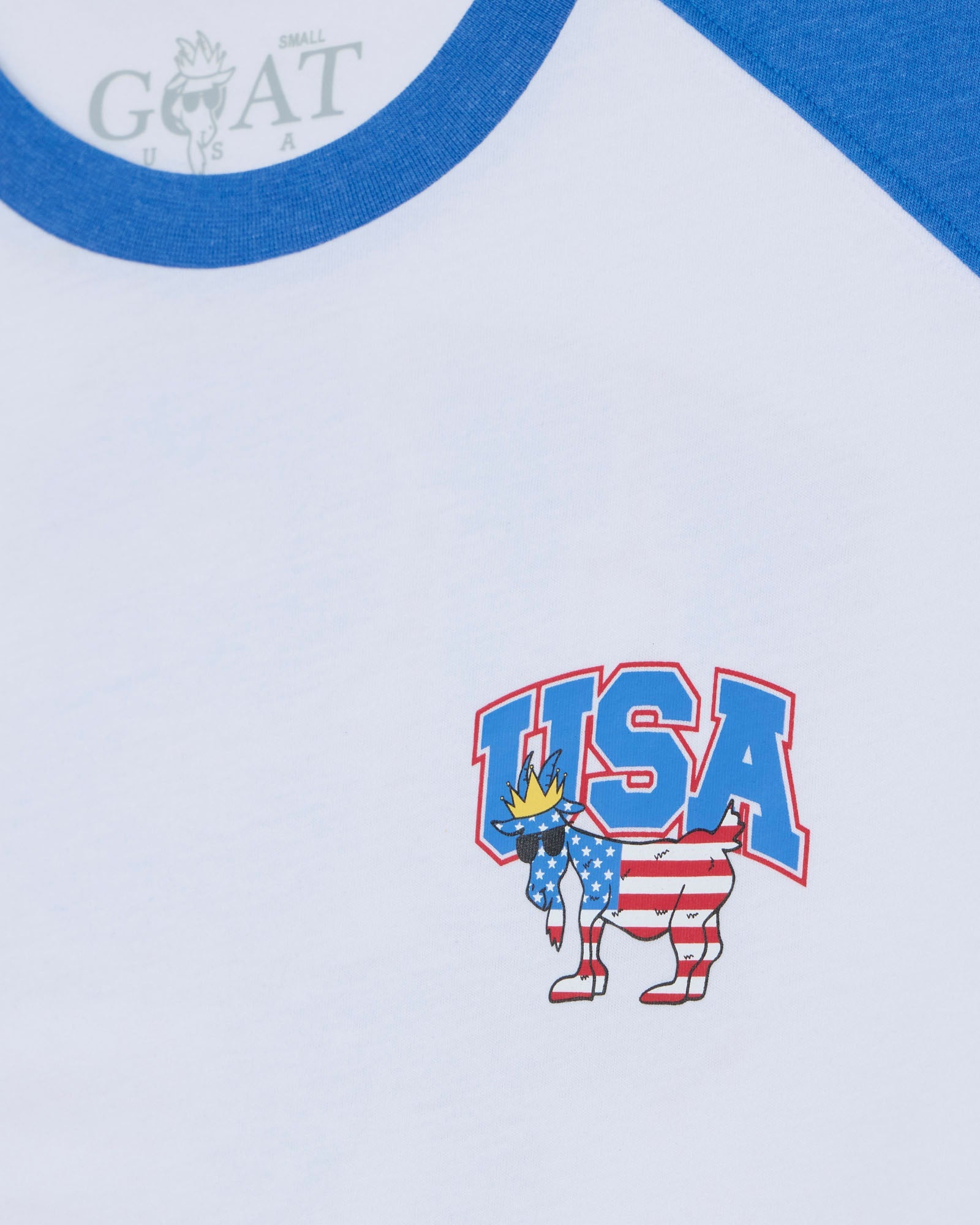 USA-themed graphic on a white shirt with blue collar, featuring the brand 'GOAT USA'.