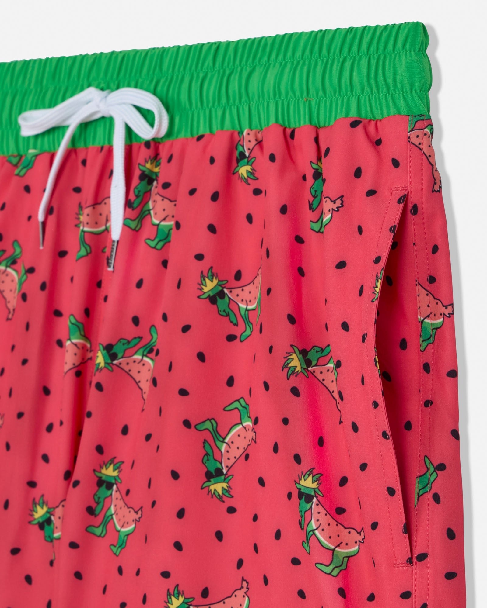 Red swim shorts with watermelon pattern and green waistband on a white background