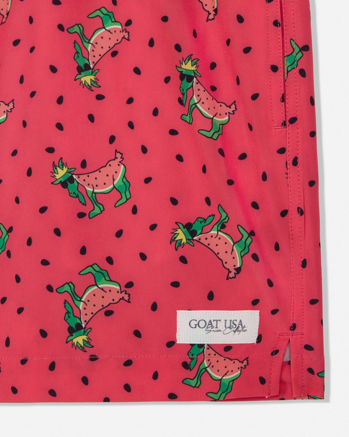 Red swim shorts with watermelon and goat pattern and 'GOAT USA' label.
