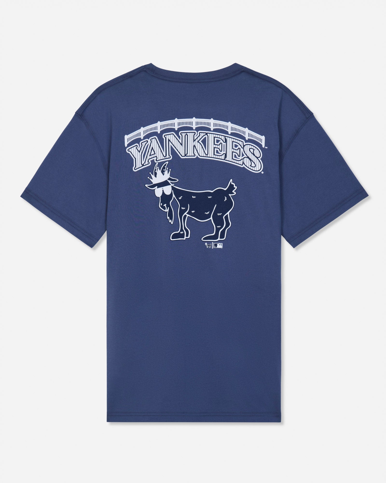 A navy blue short-sleeve t-shirt with a white graphic on the back featuring the word 'YANKEES' in an arched font above a detailed goat mascot illustration, set against a light gray background.#color_navy