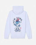 White pullover hoodie shown from the back, featuring a large graphic print of a cartoon blue goat in a baseball uniform with a red, white, and blue top hat, surrounded by the text 'NEW YORK GOAT USA'.