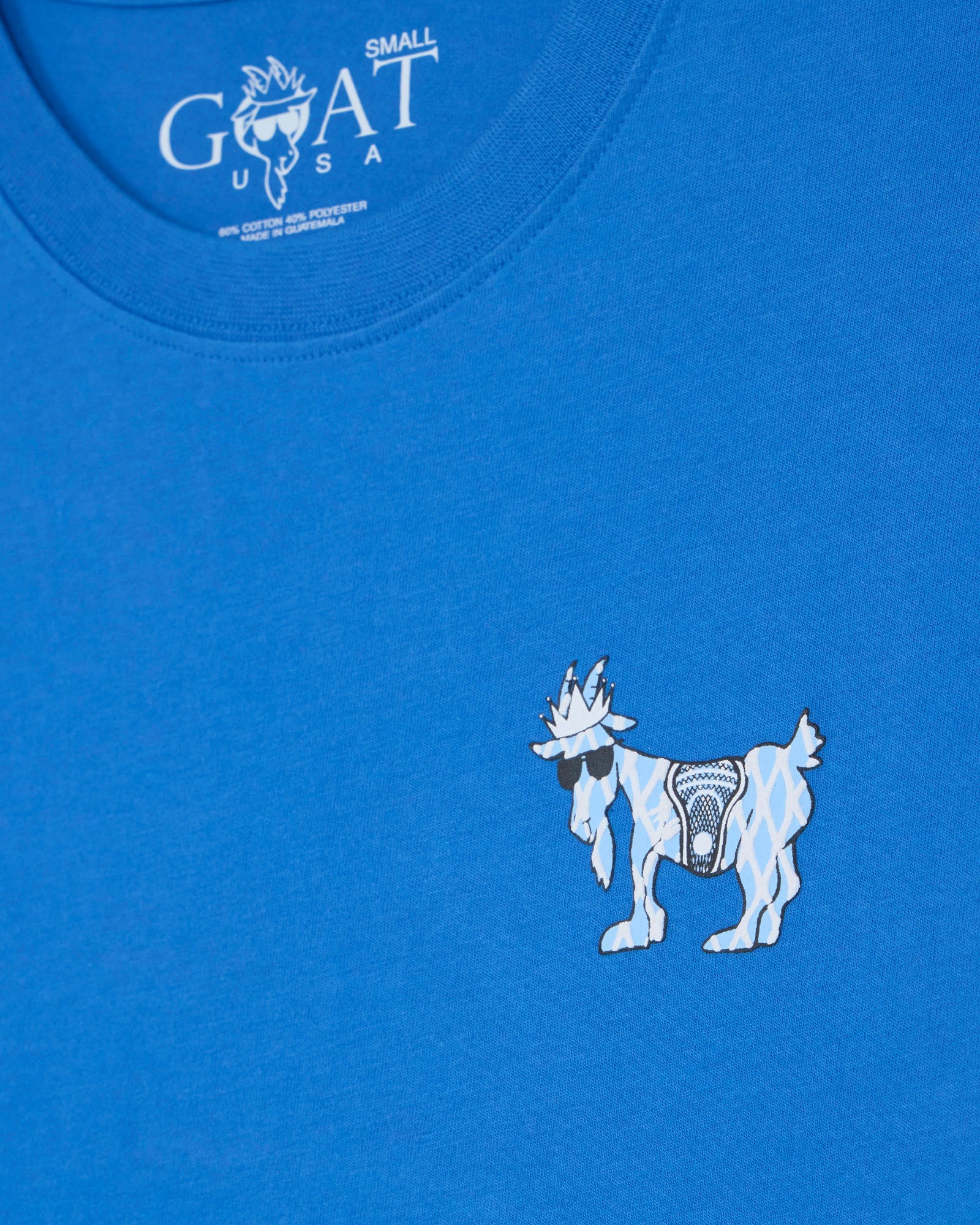Blue t-shirt with a white goat graphic and 'GOAT USA' logo.