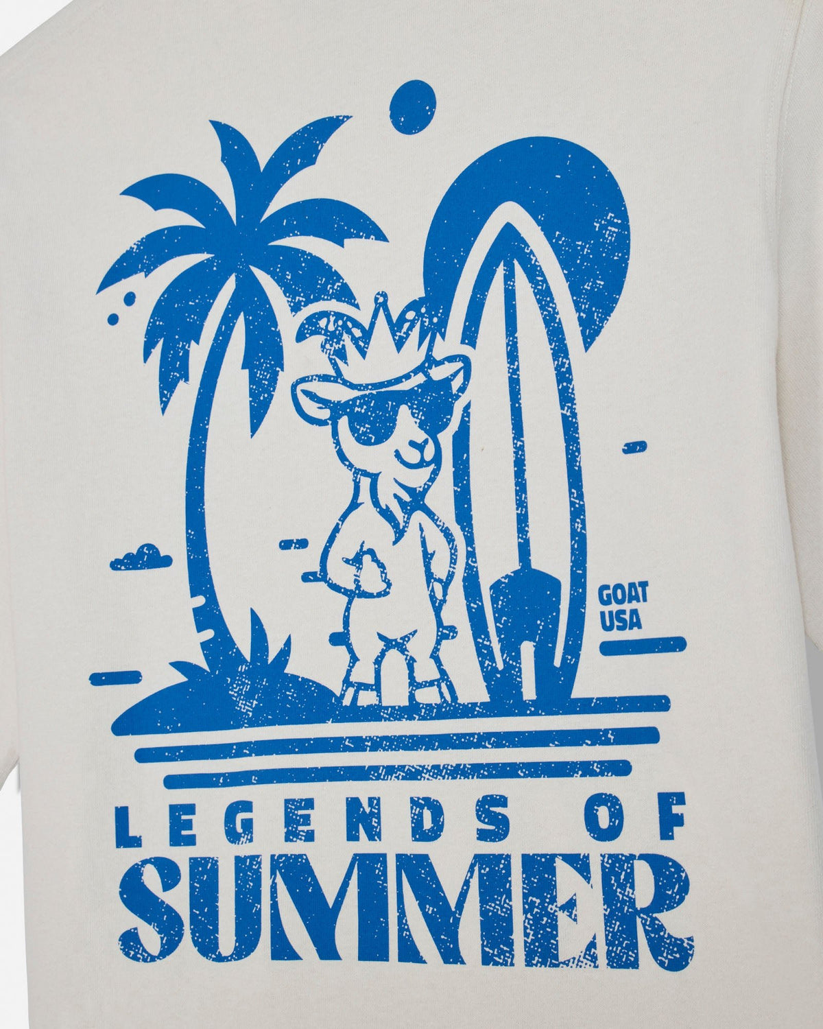 T-shirt with blue graphic of a goat with sunglasses, palm tree, and surfboard with 'Legends of Summer' text on a white background.