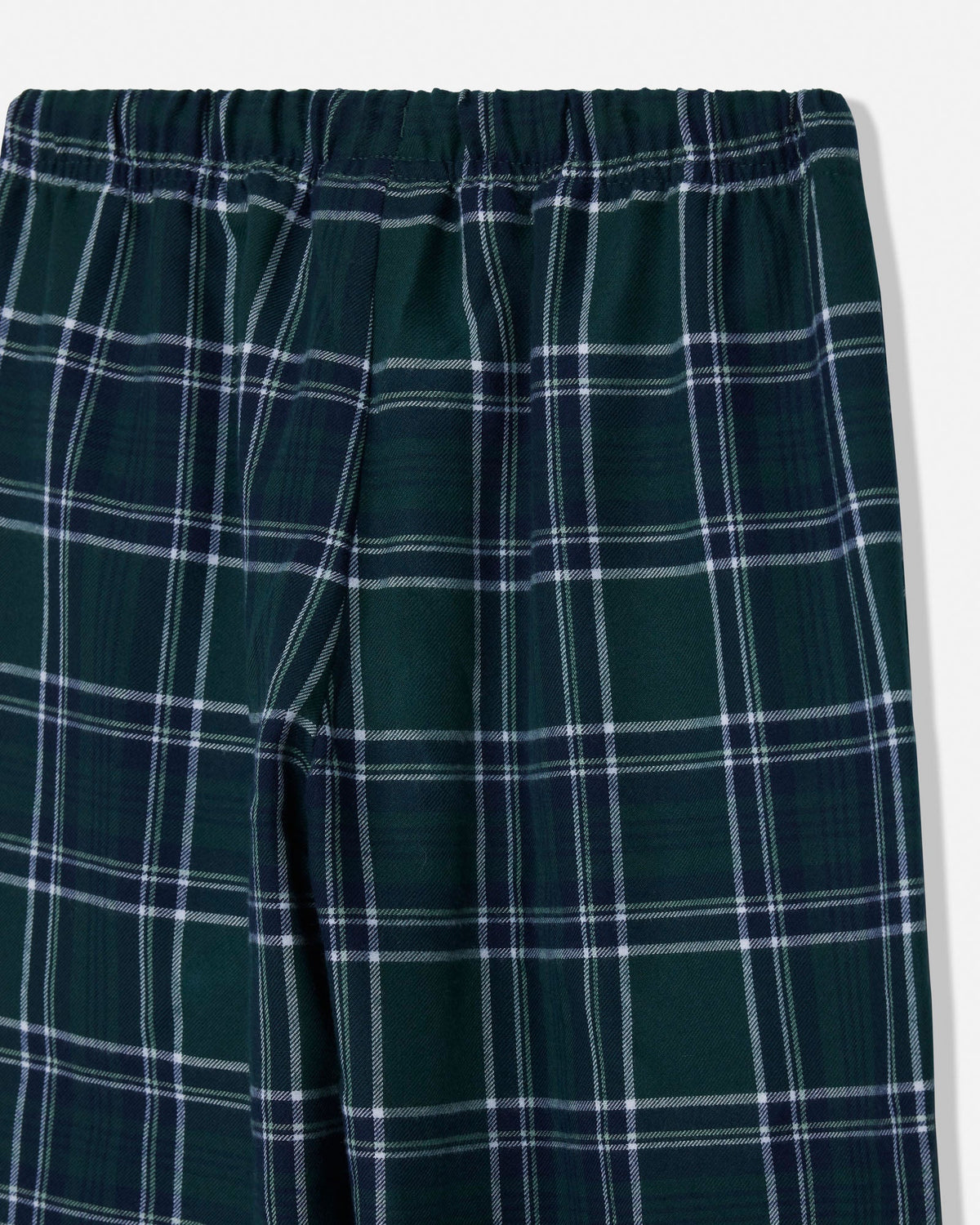 Close-up of green pajama pants on a white background