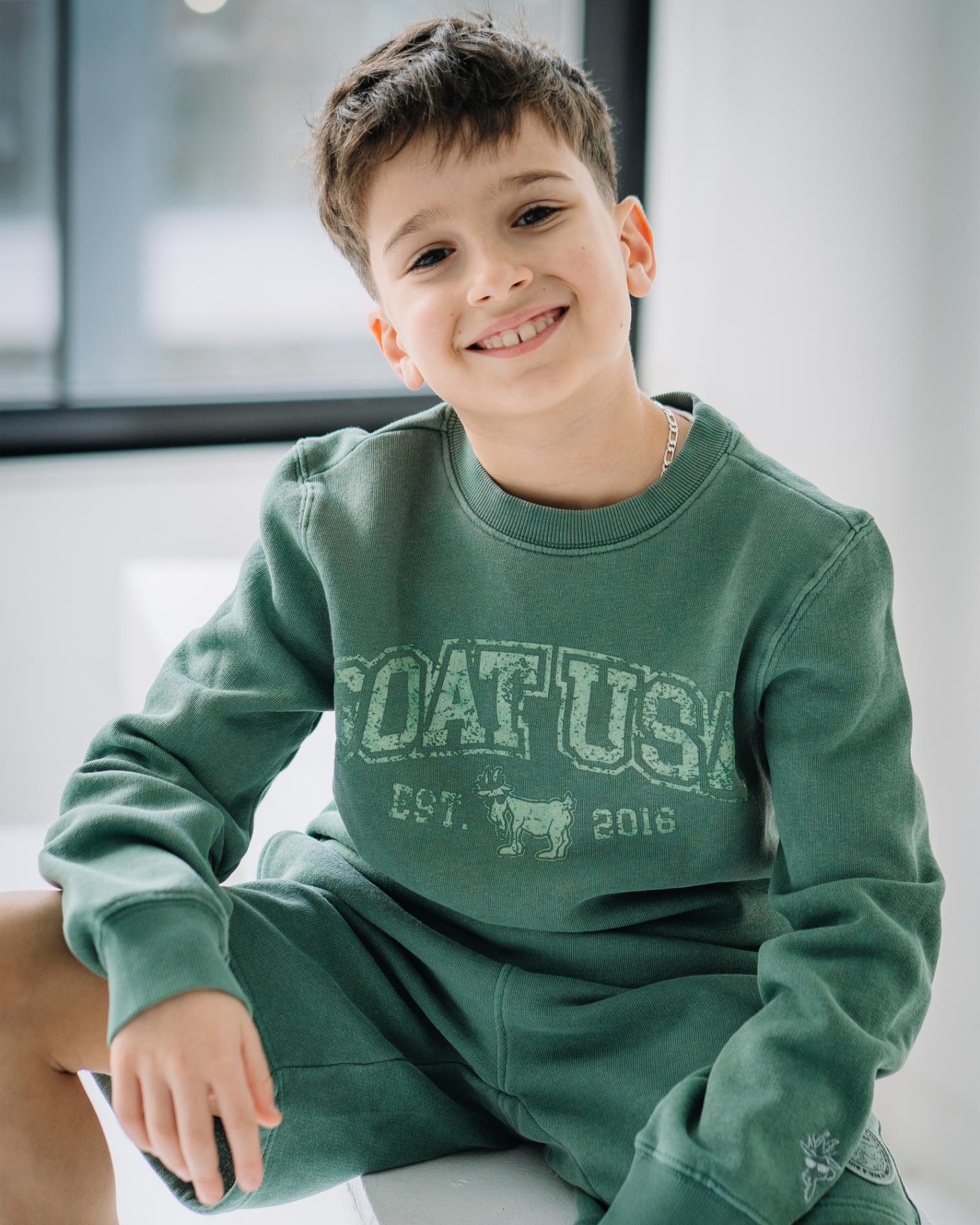 Boy wearing alpine-colored men's sweat shorts#color_alpine