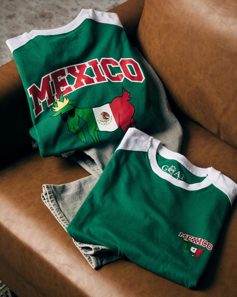 Green shirts with 'Mexico' text on a brown couch