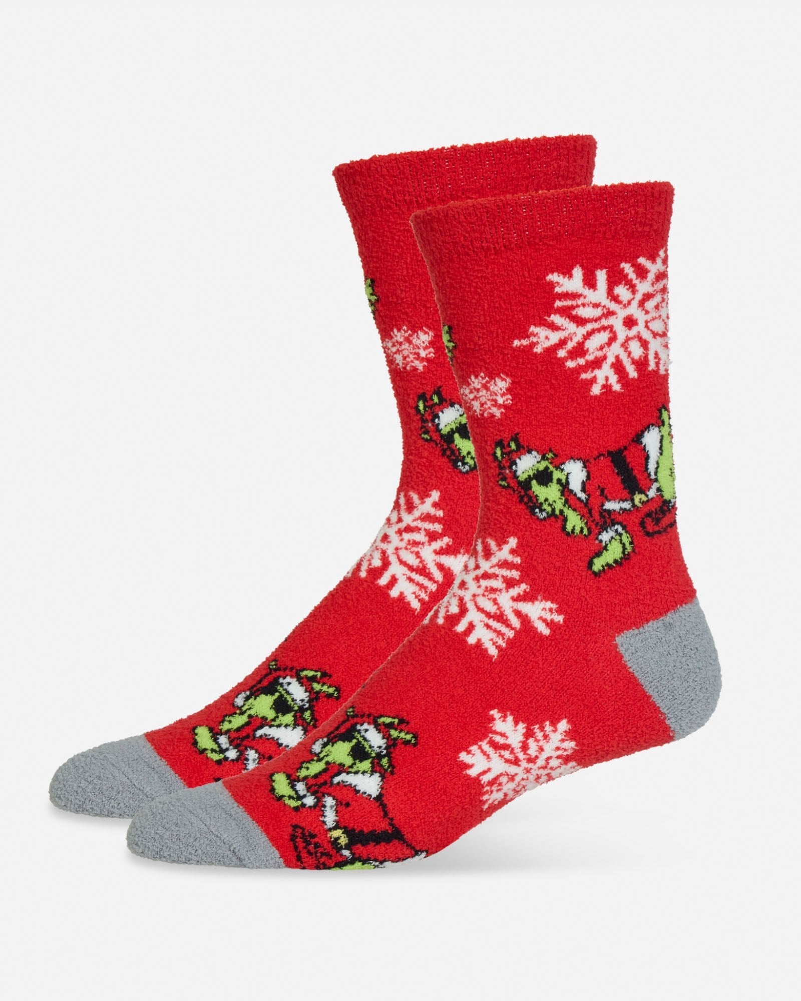 Red socks with naughty Santa goat and snowflake designs on a white background