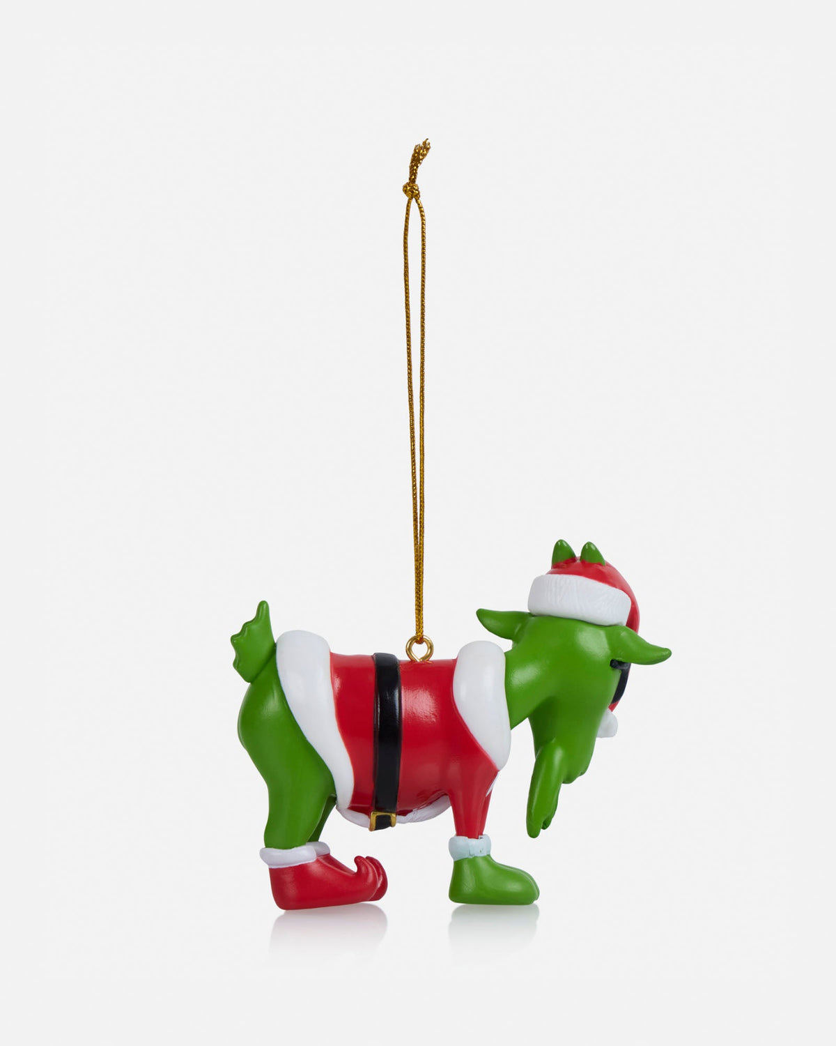 Christmas ornament of a green elf in a red suit on a white background