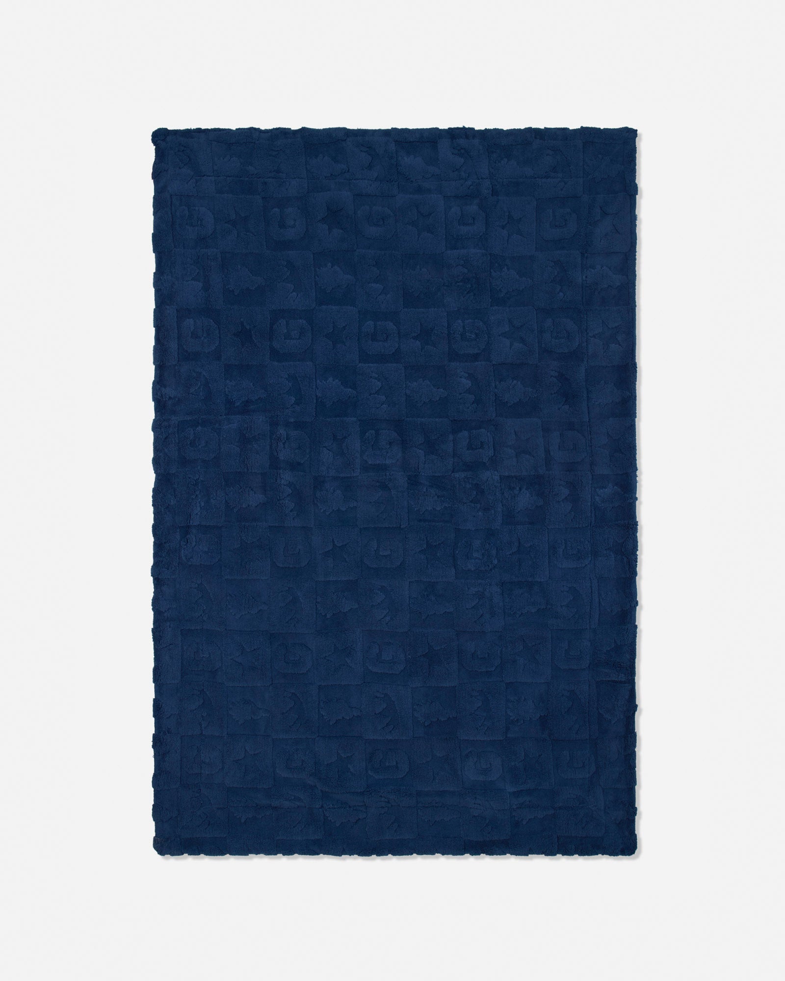 A dark navy blue rectangular blanket with a textured, embossed checkerboard pattern and fringed edges, shown flat against a light gray background.