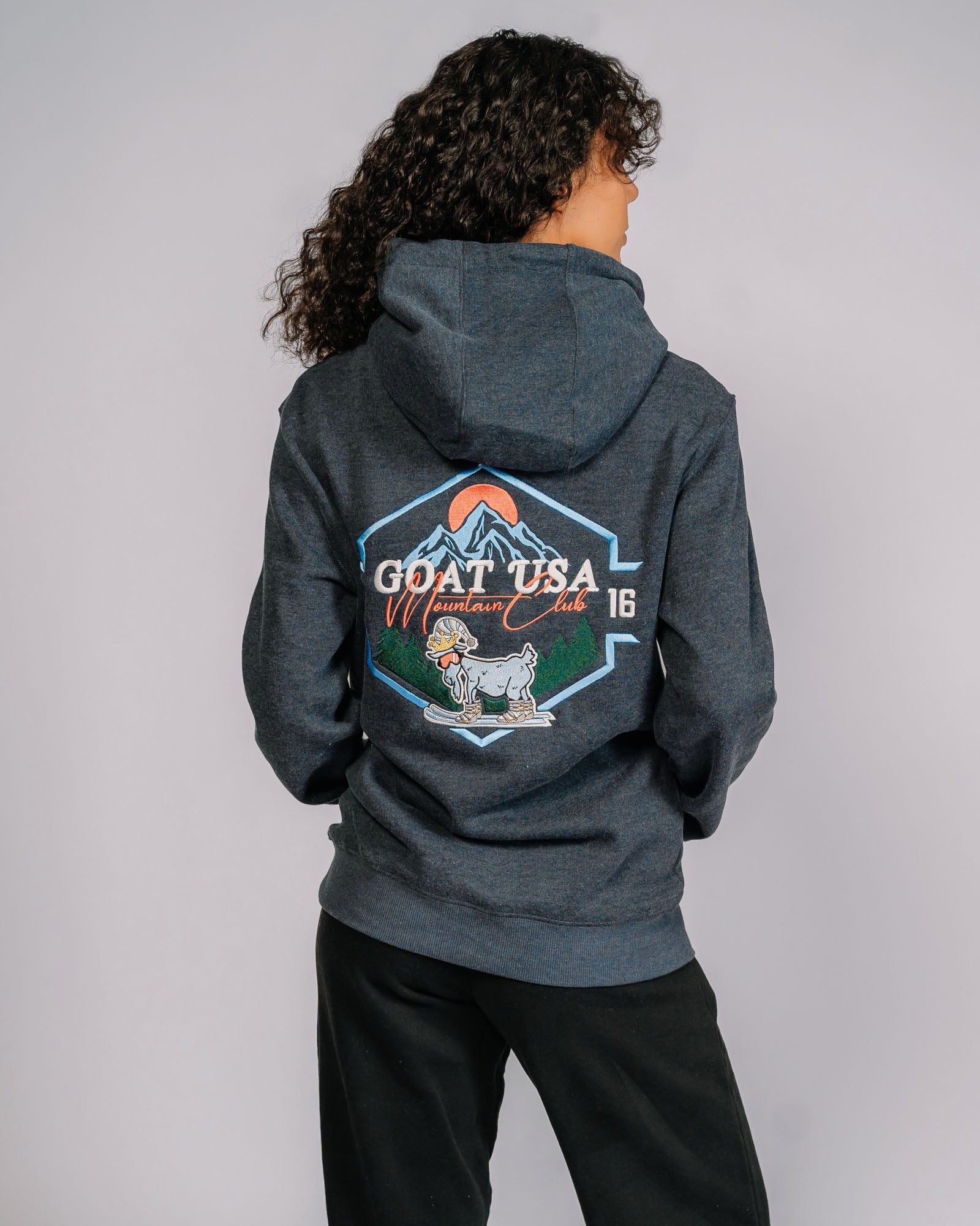 Back of Mountain Club hoodie with skiing goat