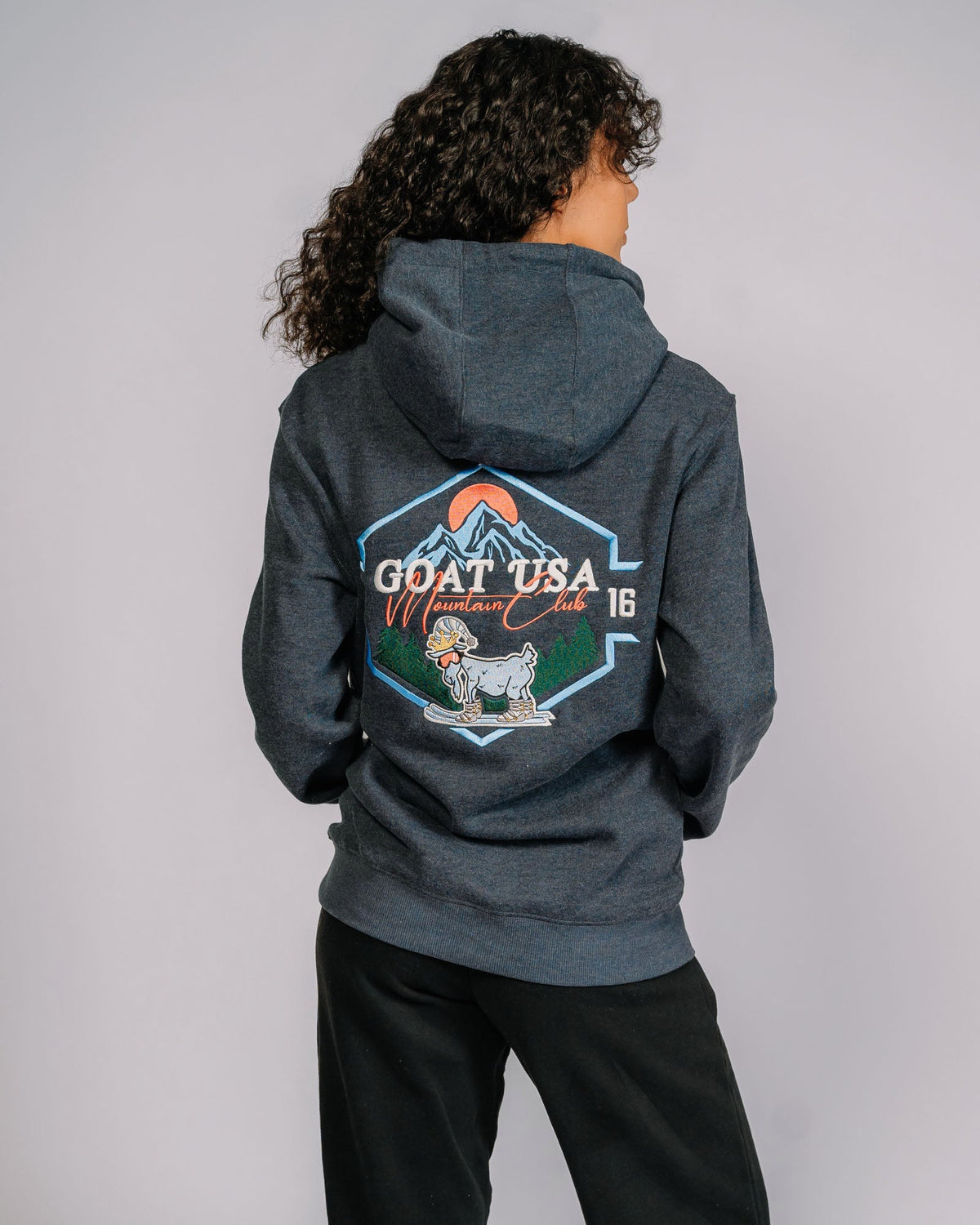 Back of Mountain Club hoodie with skiing goat