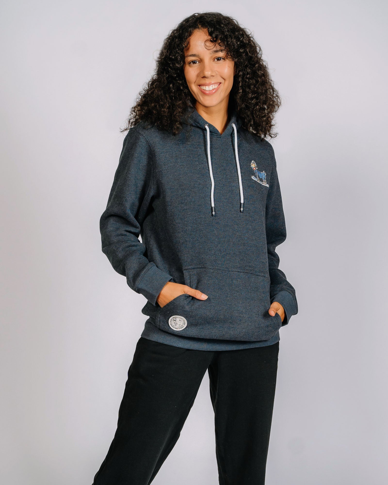 Female model wearing navy skiing goat sweatshirt