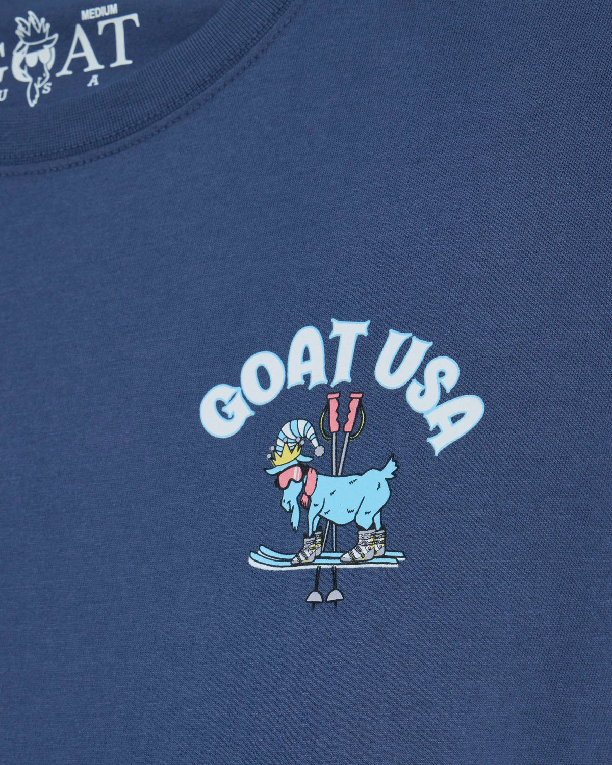 Blue t-shirt with 'GOAT USA' graphic design featuring a goat on skis.