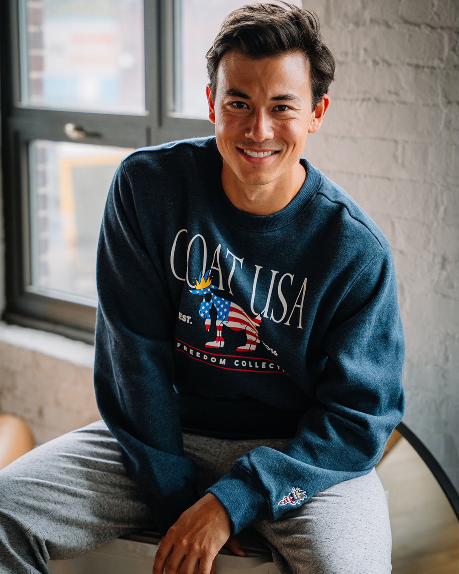 Model wearing navy Freedom North Tyson Crewneck Sweatshirt#color_navy