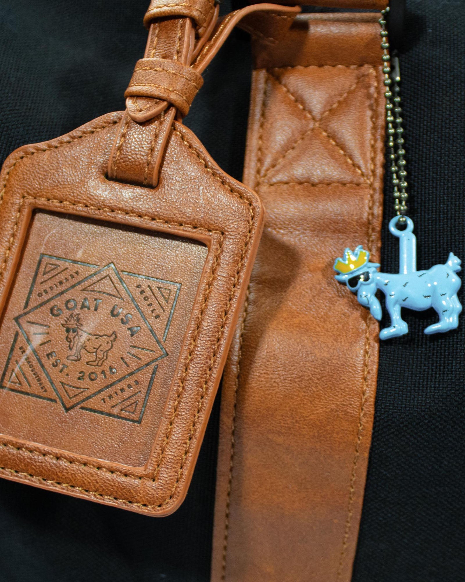 Luggage tag on black OG Duffel Bag#color_black