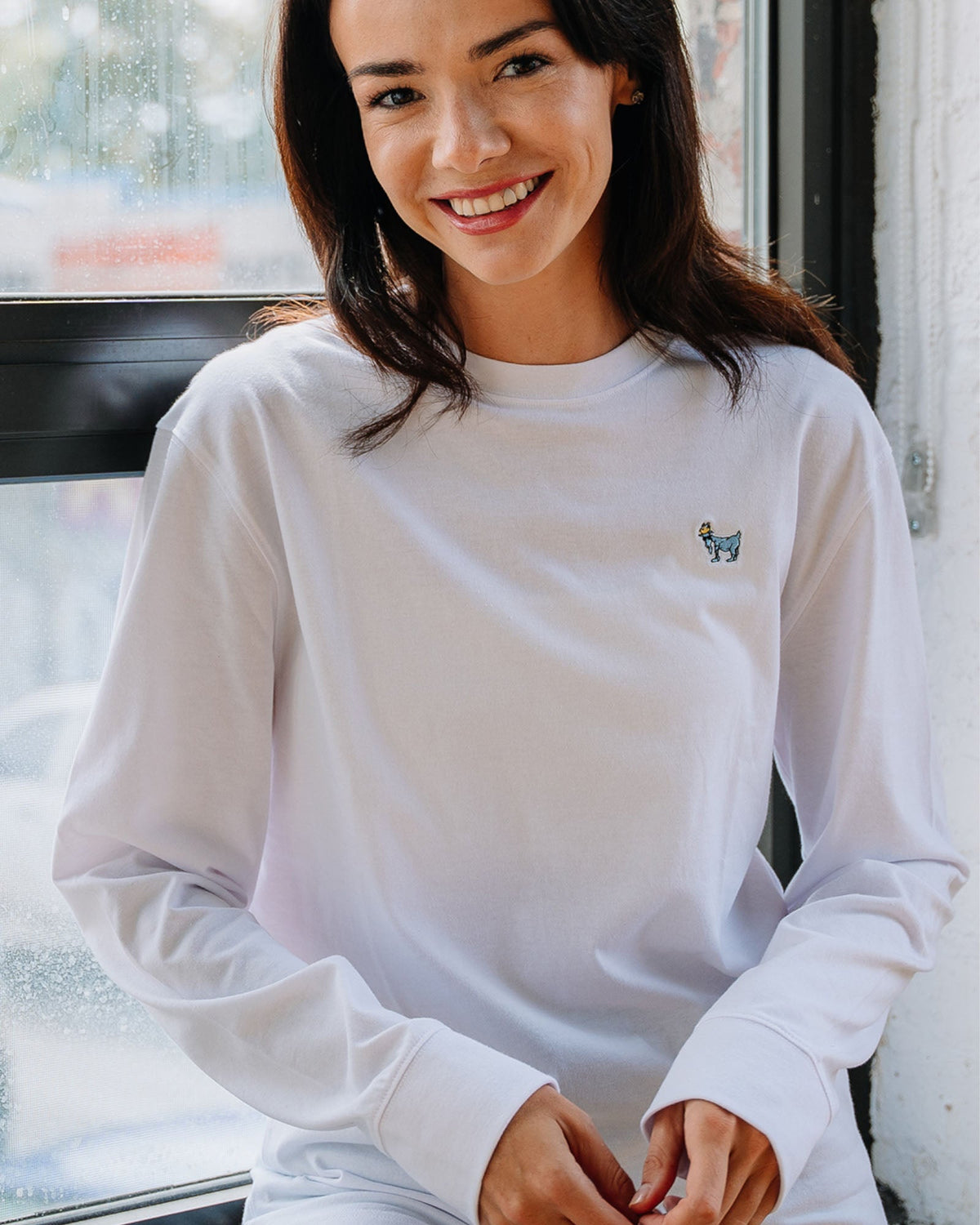 Model wearing white OG Embroidered LST