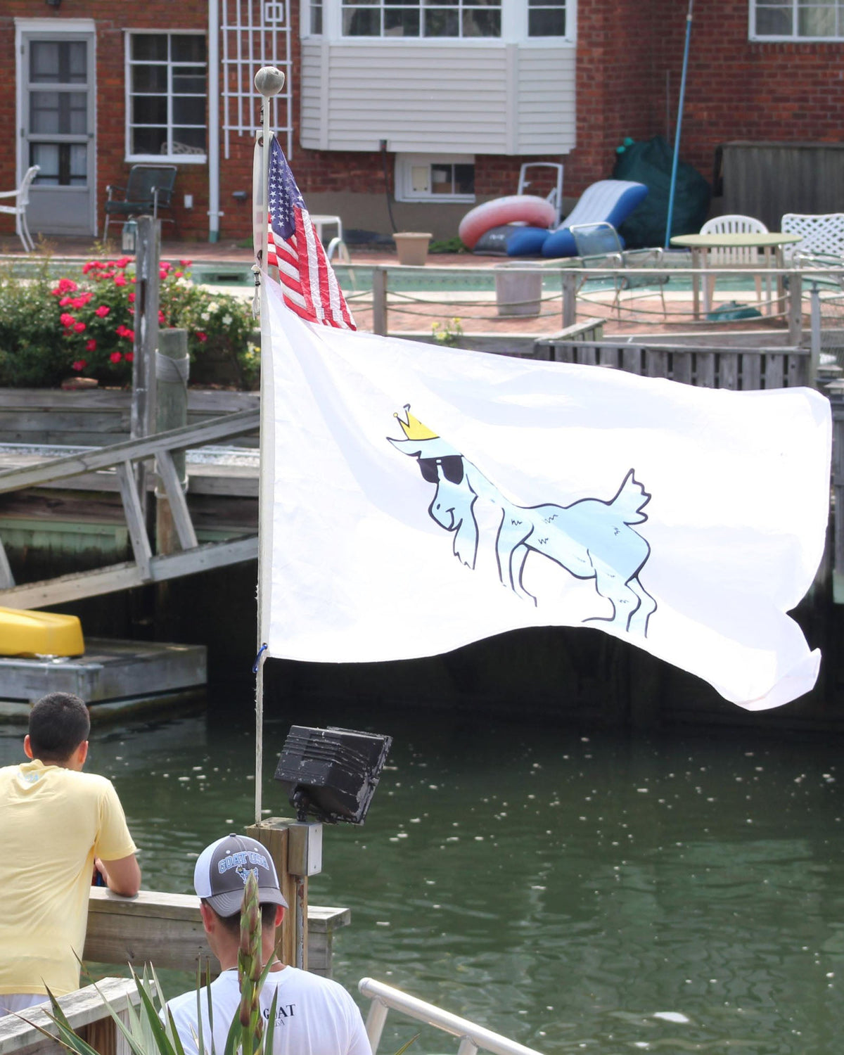 White GOAT Flag with carolina blue goat flowing in the wind