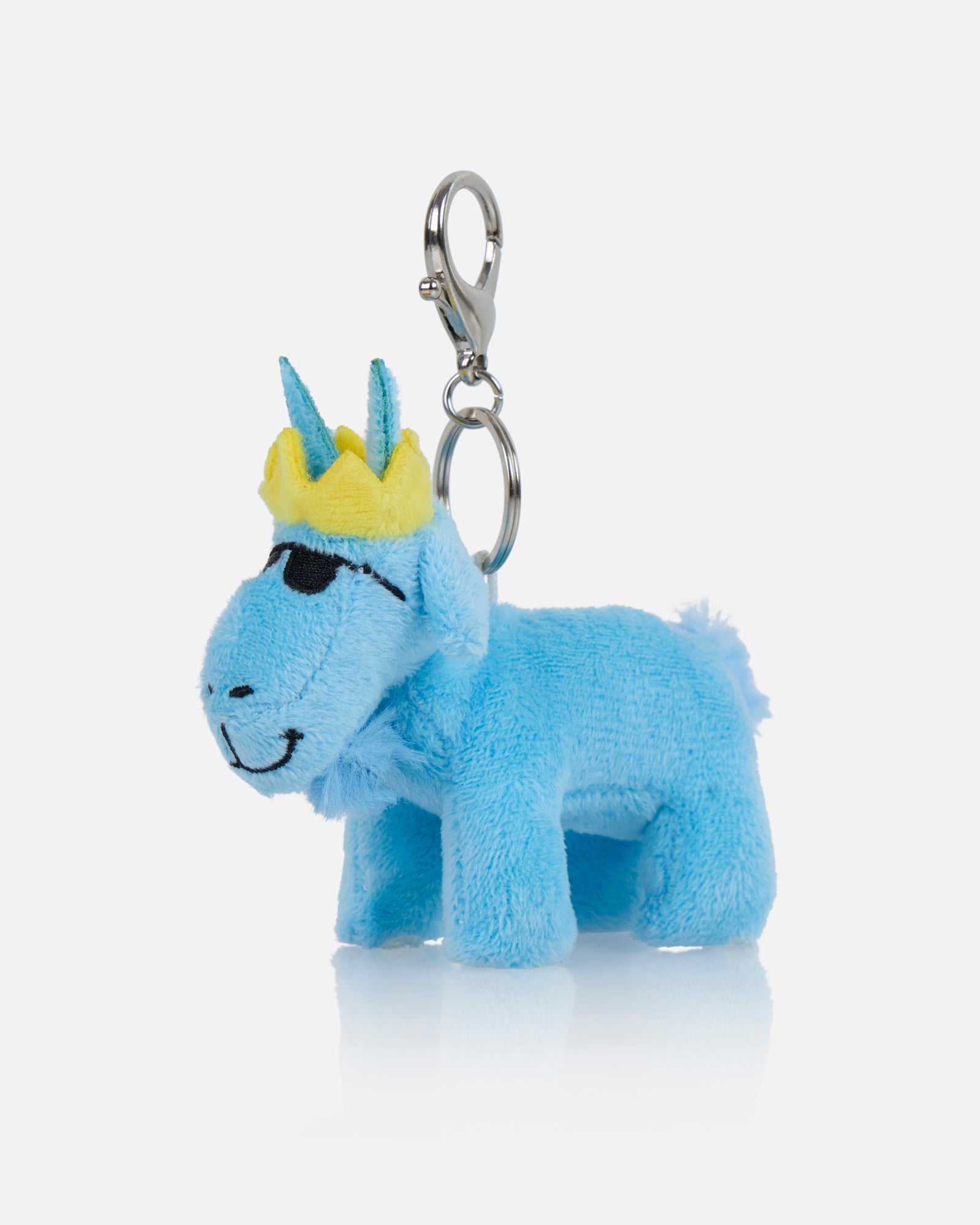 Blue plush keychain with a yellow crown on a white background