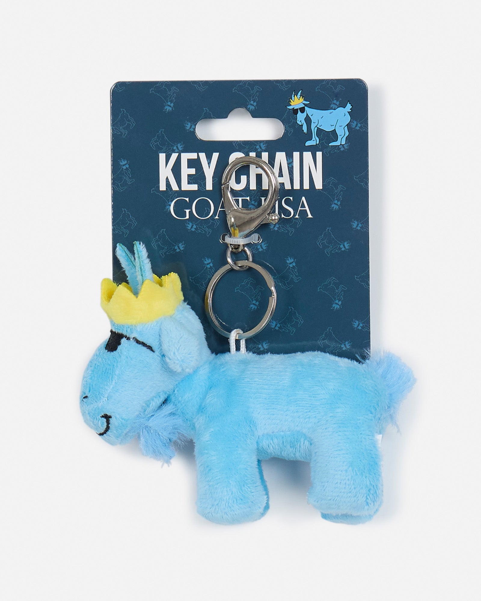 Blue plush keychain with a crown on a blue card labeled 'Key Chain GOAT USA'.
