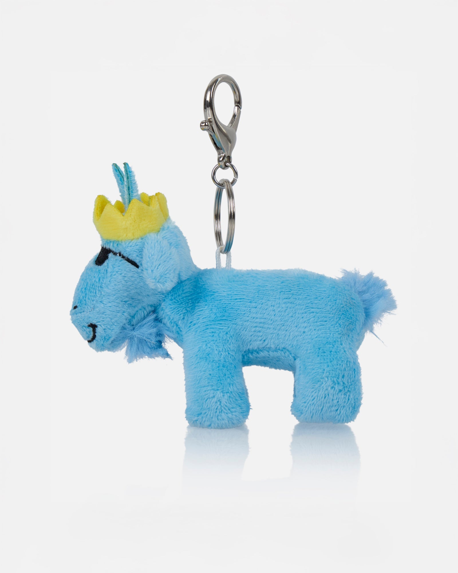 Blue plush keychain with a yellow crown on a white background