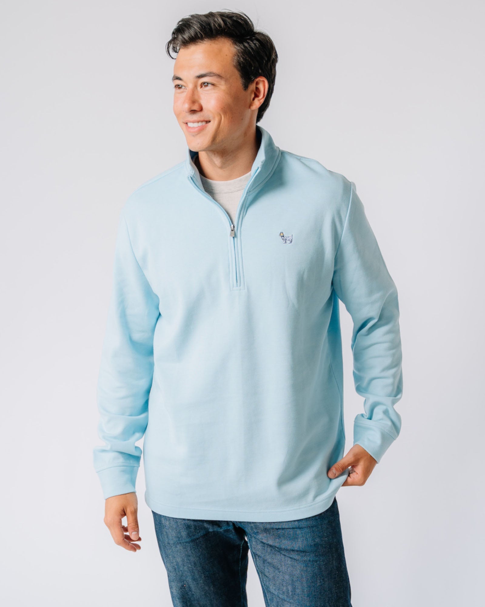 Model wearing carolina blue OG Roosevelt Men's 1/4 Zip#color_carolina-blue