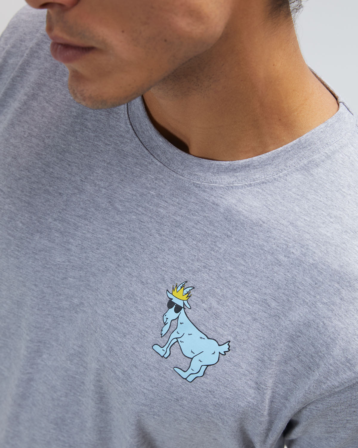 Close up of logo on gray OG T-Shirt#color_gray