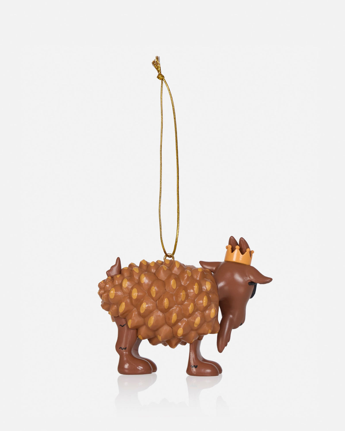 A small decorative ornament shaped like a brown goat with a textured body, a gold hanging loop, and a small gold crown on its head, shown on a clean light gray background.