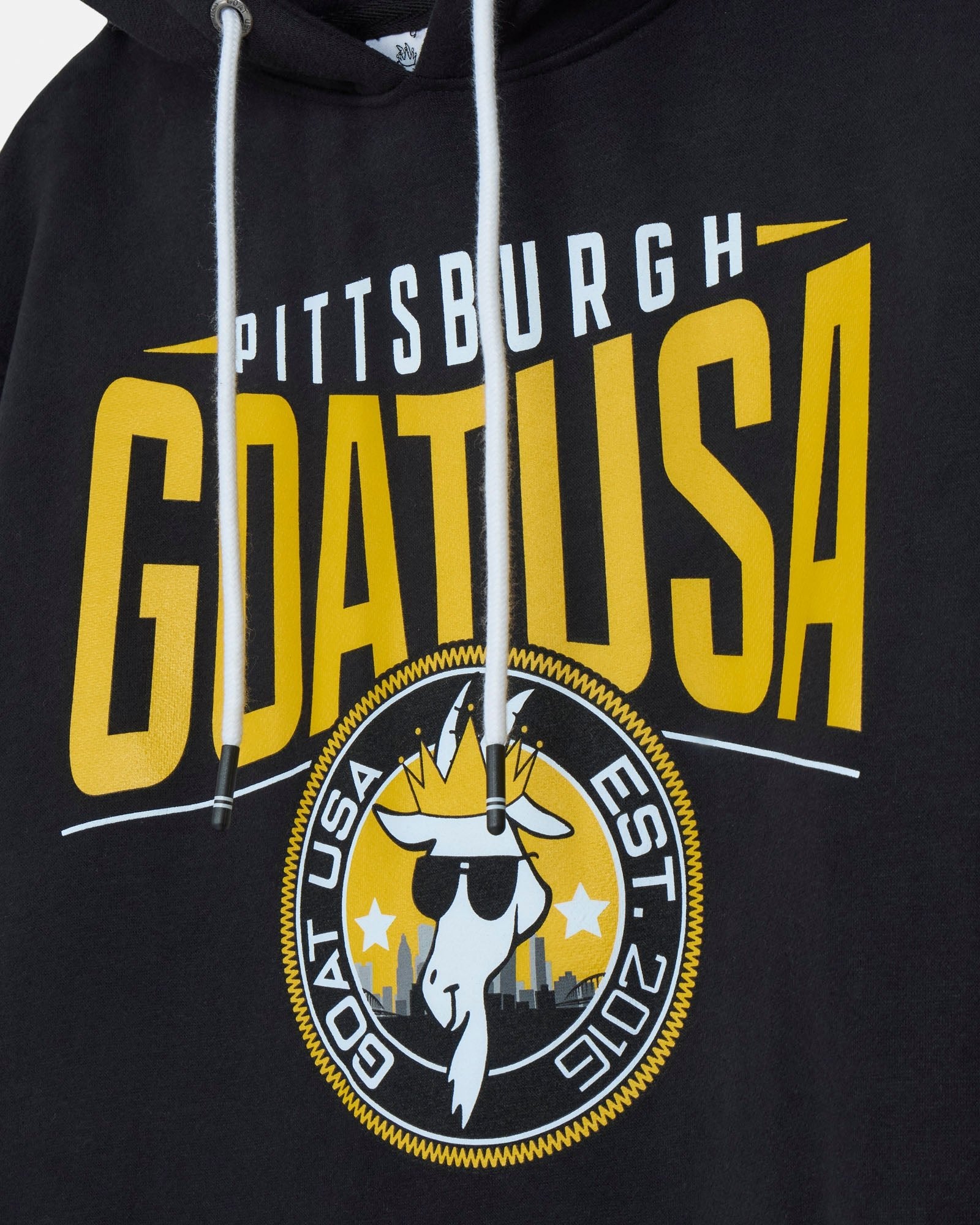 Black hoodie with yellow and white text and graphics on a gray background#color_black