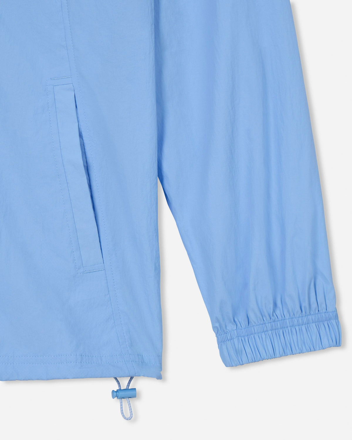 Close-up of the sleeve on the carolina blue windbreaker