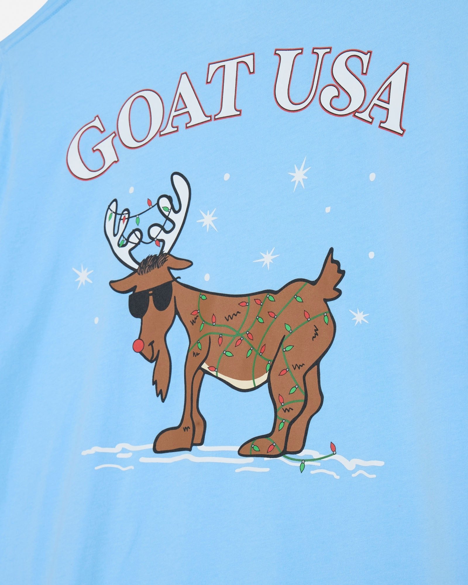 Light blue shirt with a reindeer graphic and 'GOAT USA' text on a snowy background