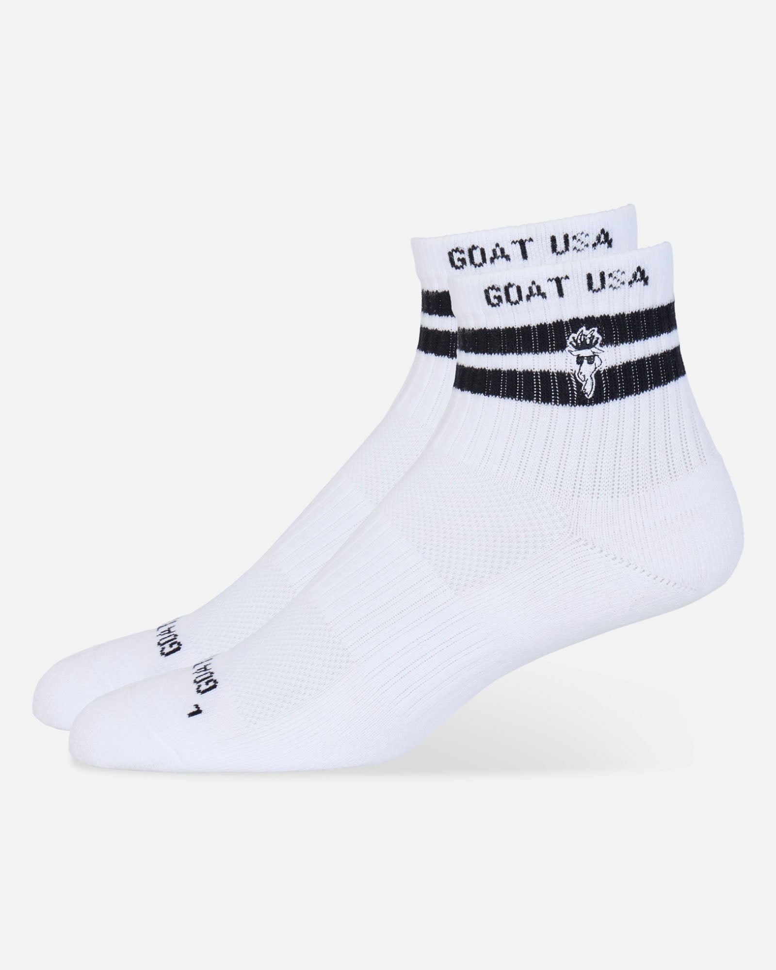 Two white ankle socks with black stripes and 'GOAT USA' branding on the cuff, displayed against a light gray background.#color_white