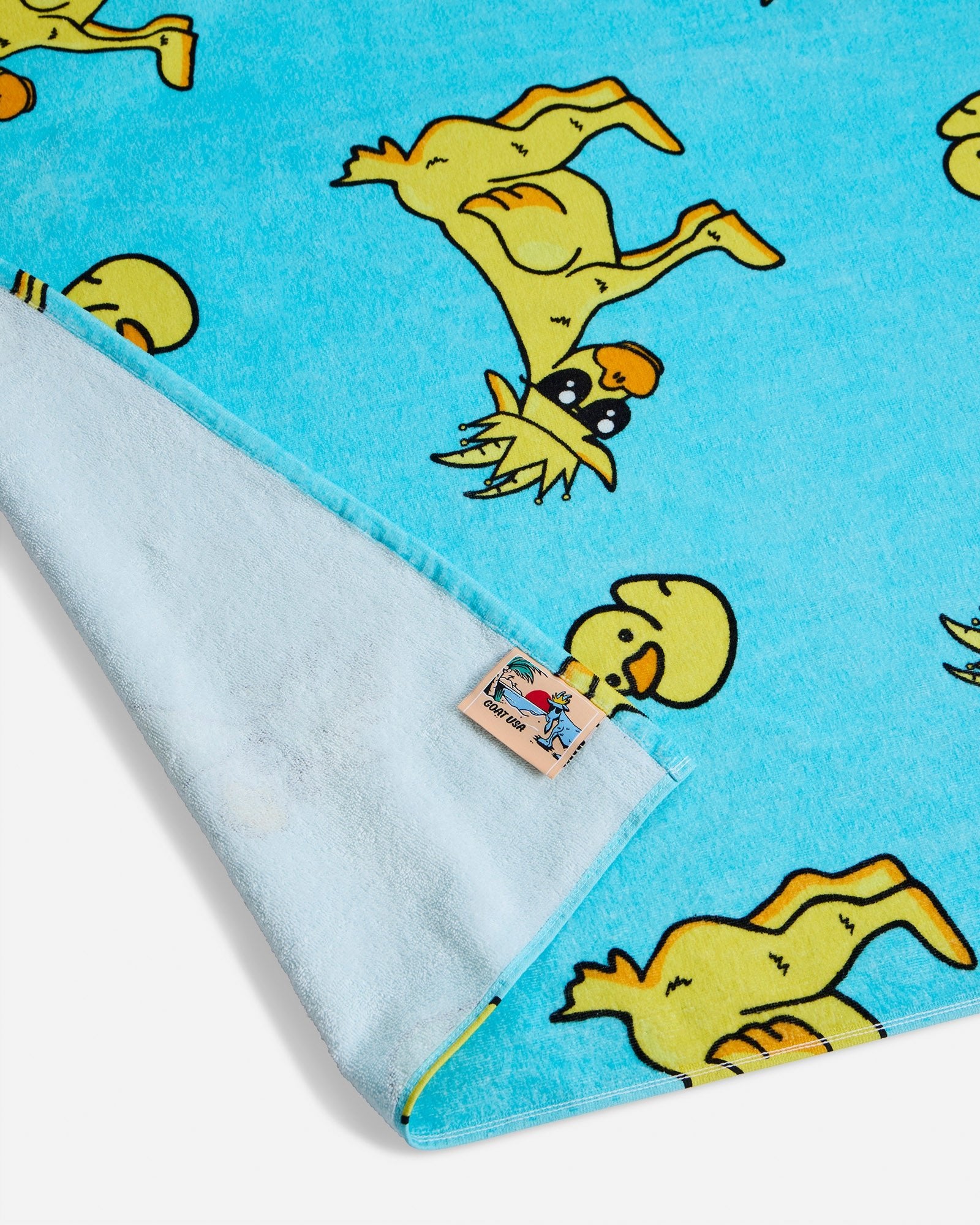 Close-up of rubber duck GOAT beach towel