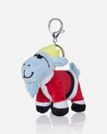A plush goat character keychain dressed in a red Santa-style outfit with white trim, black boots, and a yellow hat, attached to a silver metal clasp on a light gray background.