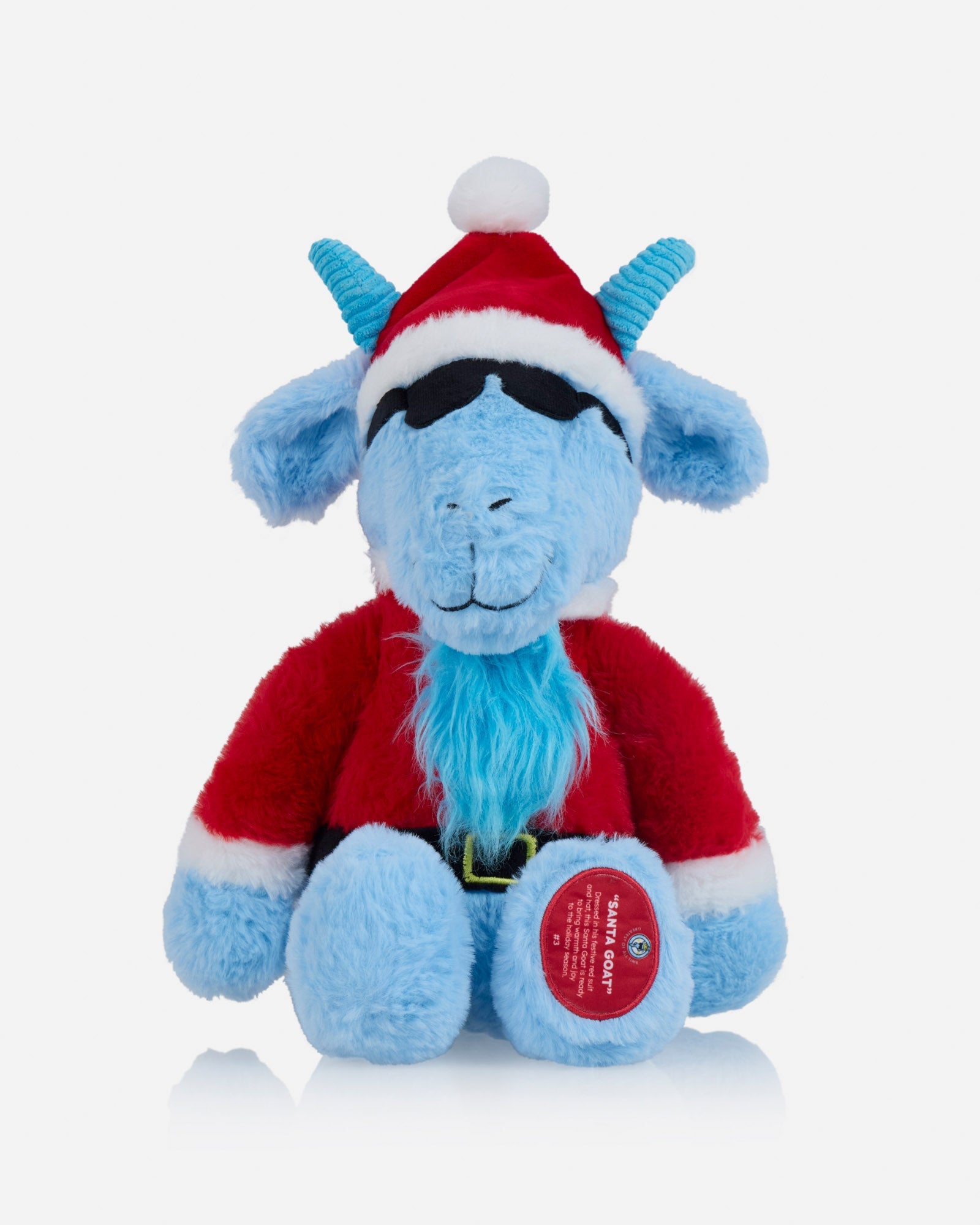 Blue plush toy with a Santa hat on a light gray background