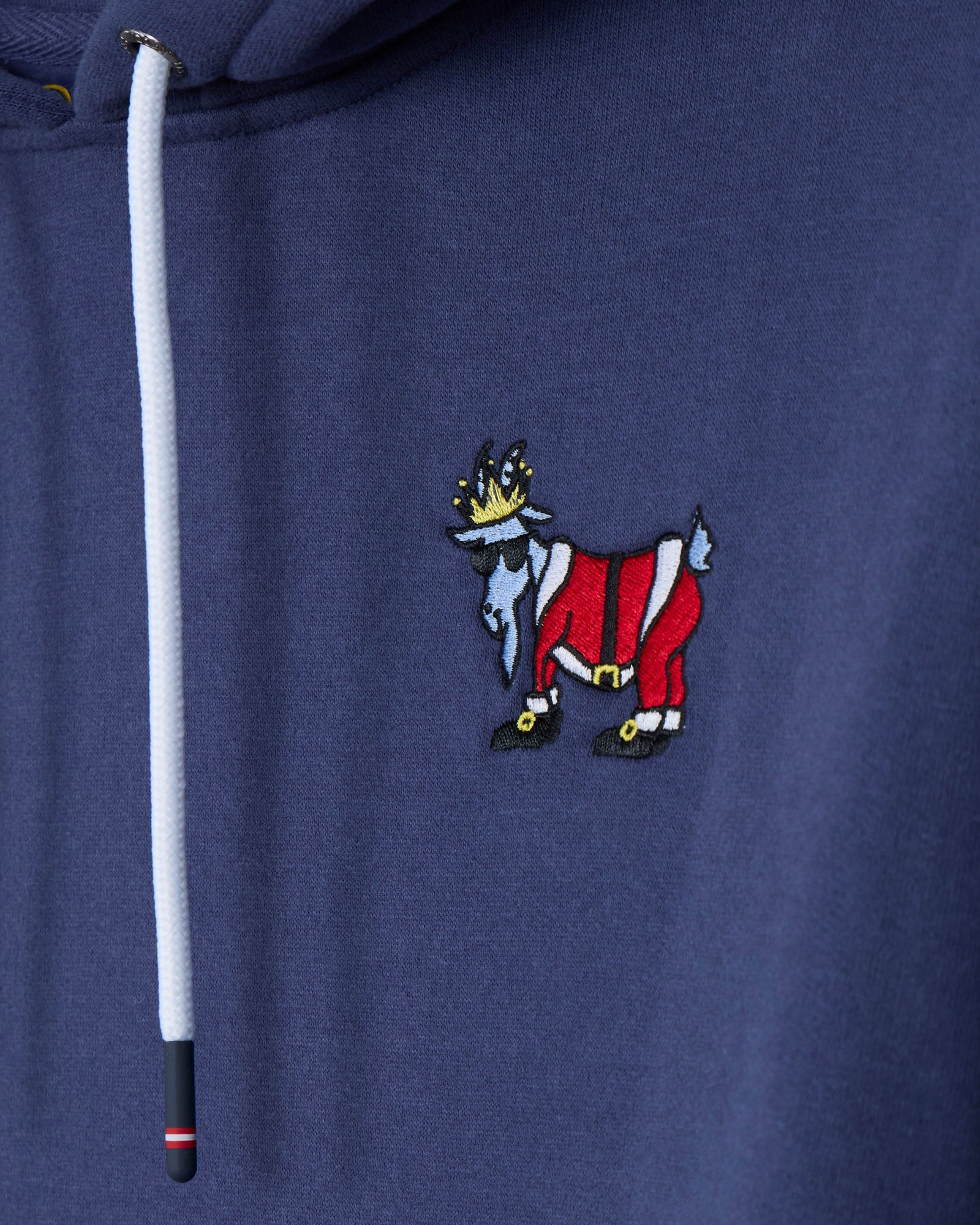 Navy blue hoodie with a colorful embroidered design on the chest.