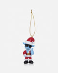 A small hanging Christmas ornament featuring a blue cartoon character dressed in a red Santa-style outfit with a red hat, white trim, black boots, and black sunglasses, suspended by a gold string on a light gray background.