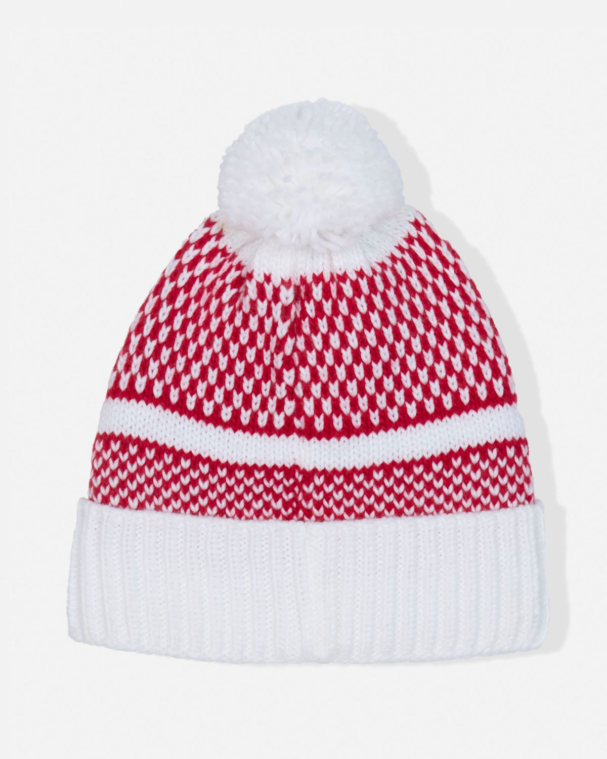 A red and white patterned knit beanie hat with a white pom-pom on top and a white ribbed cuff, shown against a plain light background.