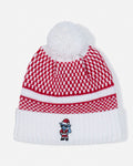 A red and white patterned knit beanie with a white pom-pom on top and a white ribbed cuff, featuring a small embroidered cartoon character wearing a Santa hat on the front.