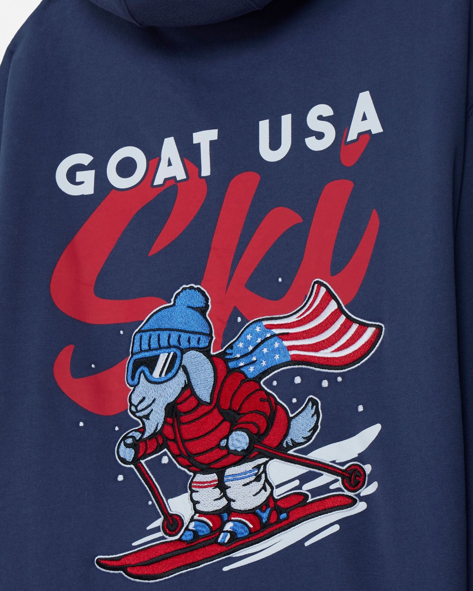 Navy blue hoodie with a graphic of a goat skiing and 'GOAT USA Ski' text on a blue background.