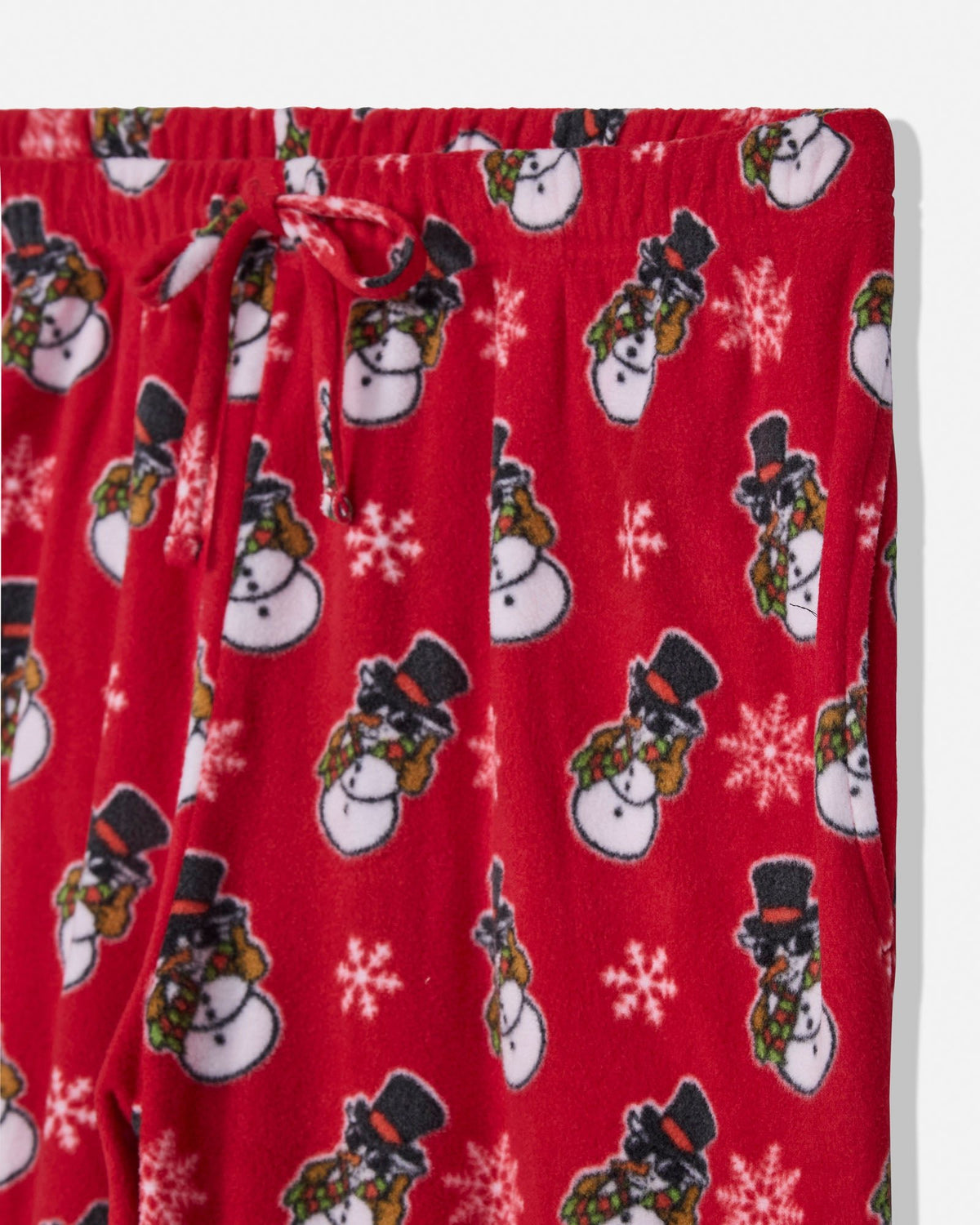 Red fleece pajama pants with an all-over snowman print, featuring white snowflakes and a matching red drawstring waistband.