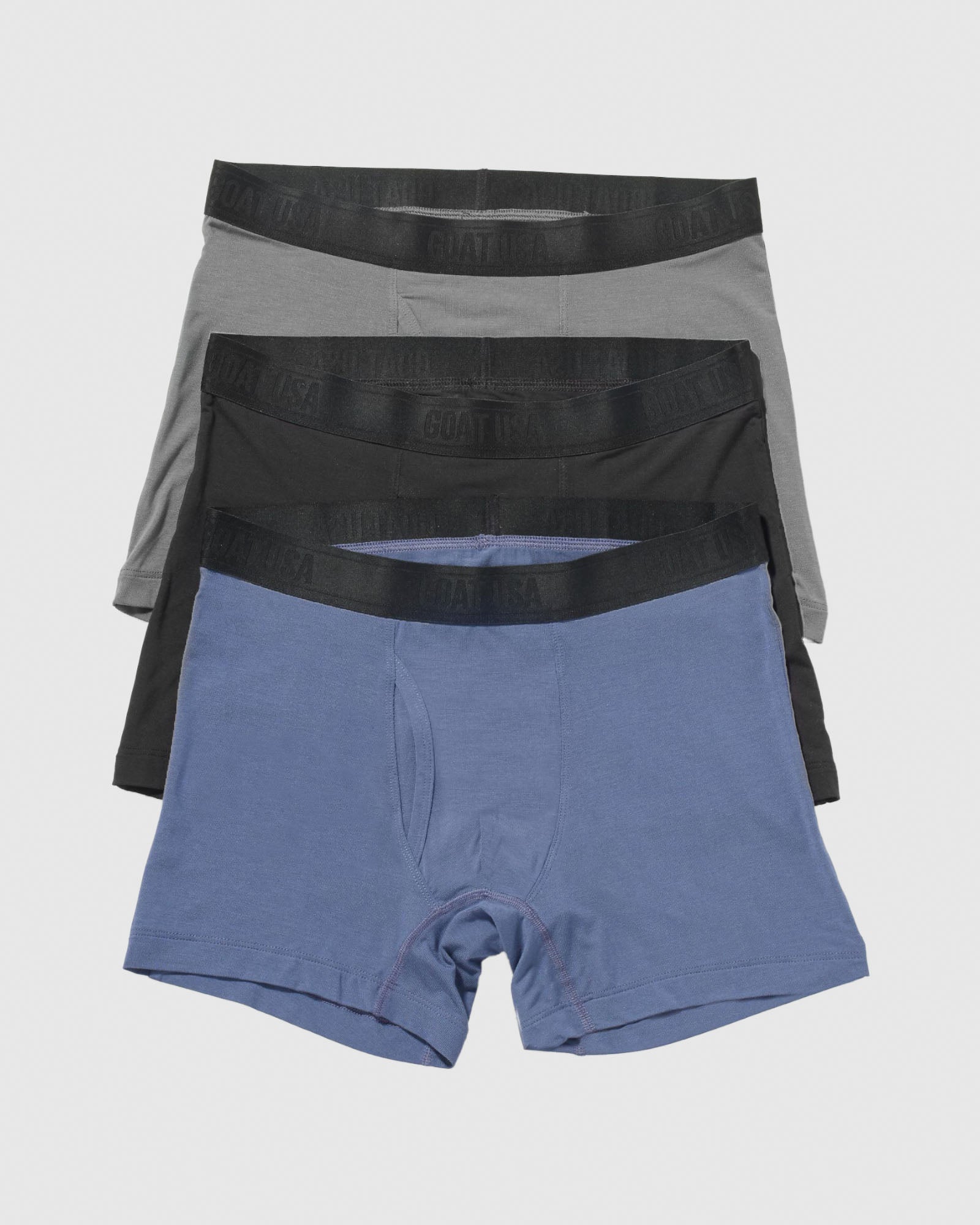 Gray black and navy boxer brief laid out