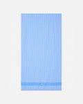 Blue and white striped towel on a light gray background