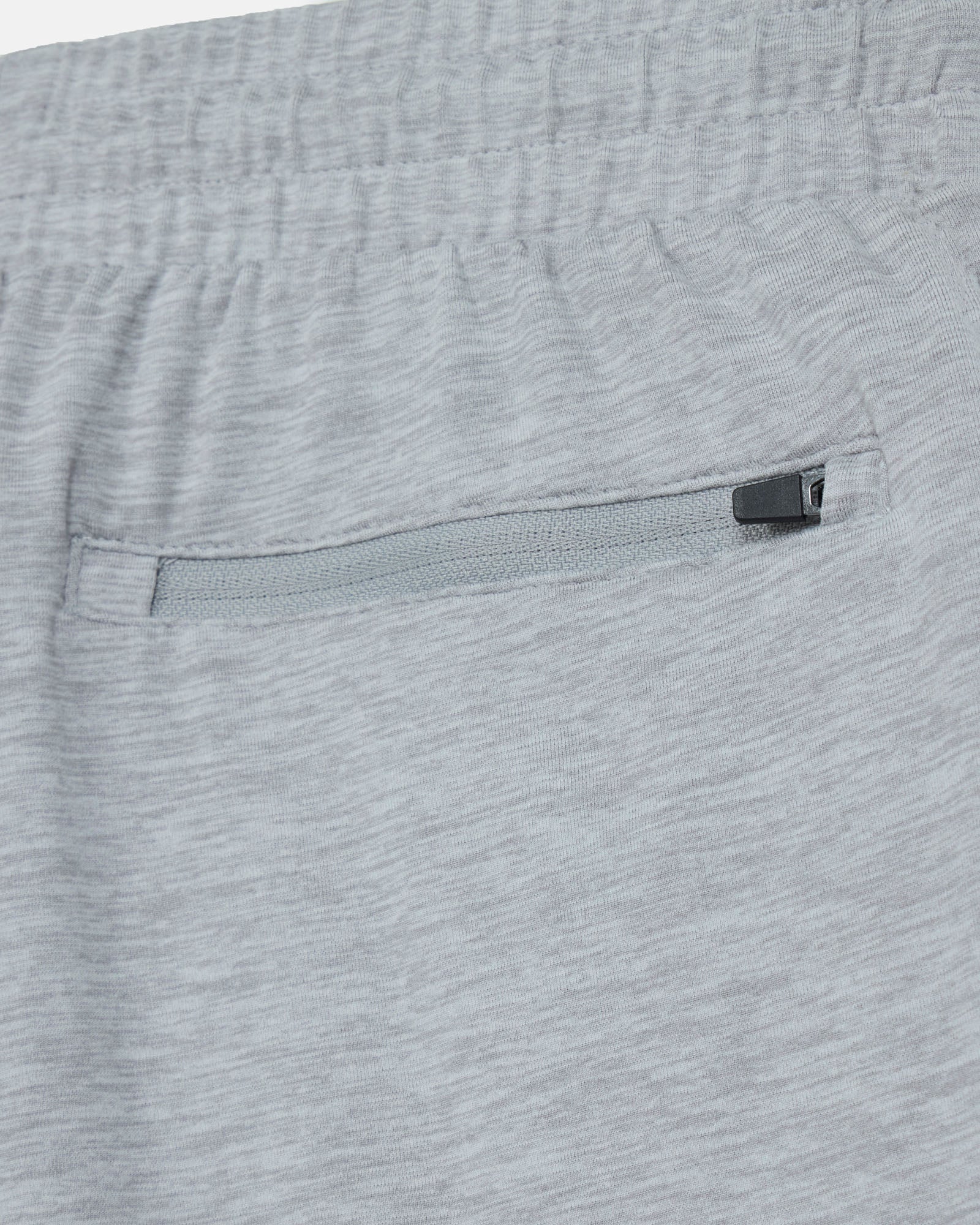 Close-up of gray shorts with a zipper pocket#color_space-dye-gray