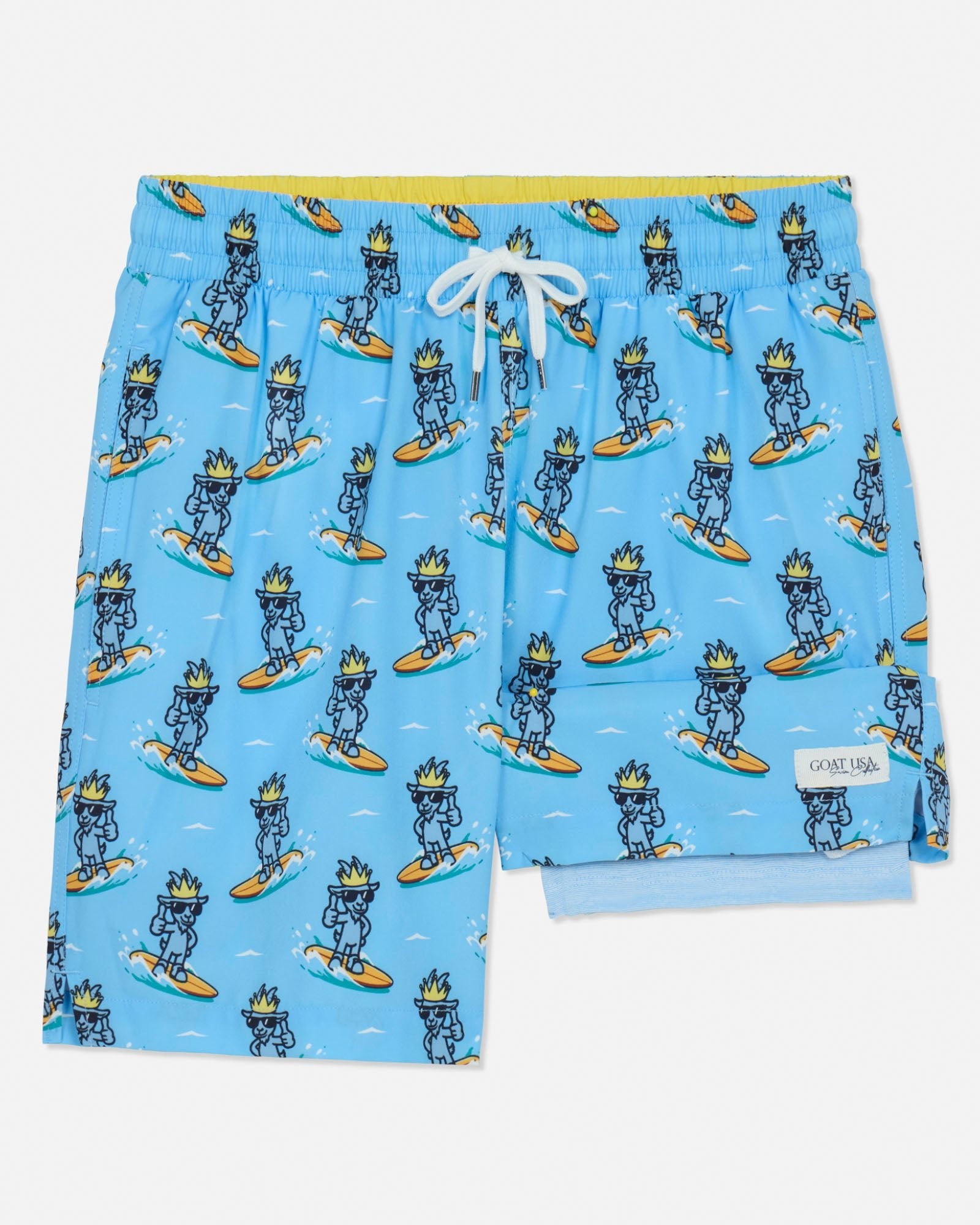 Blue swim shorts with cartoon character pattern on a light gray background