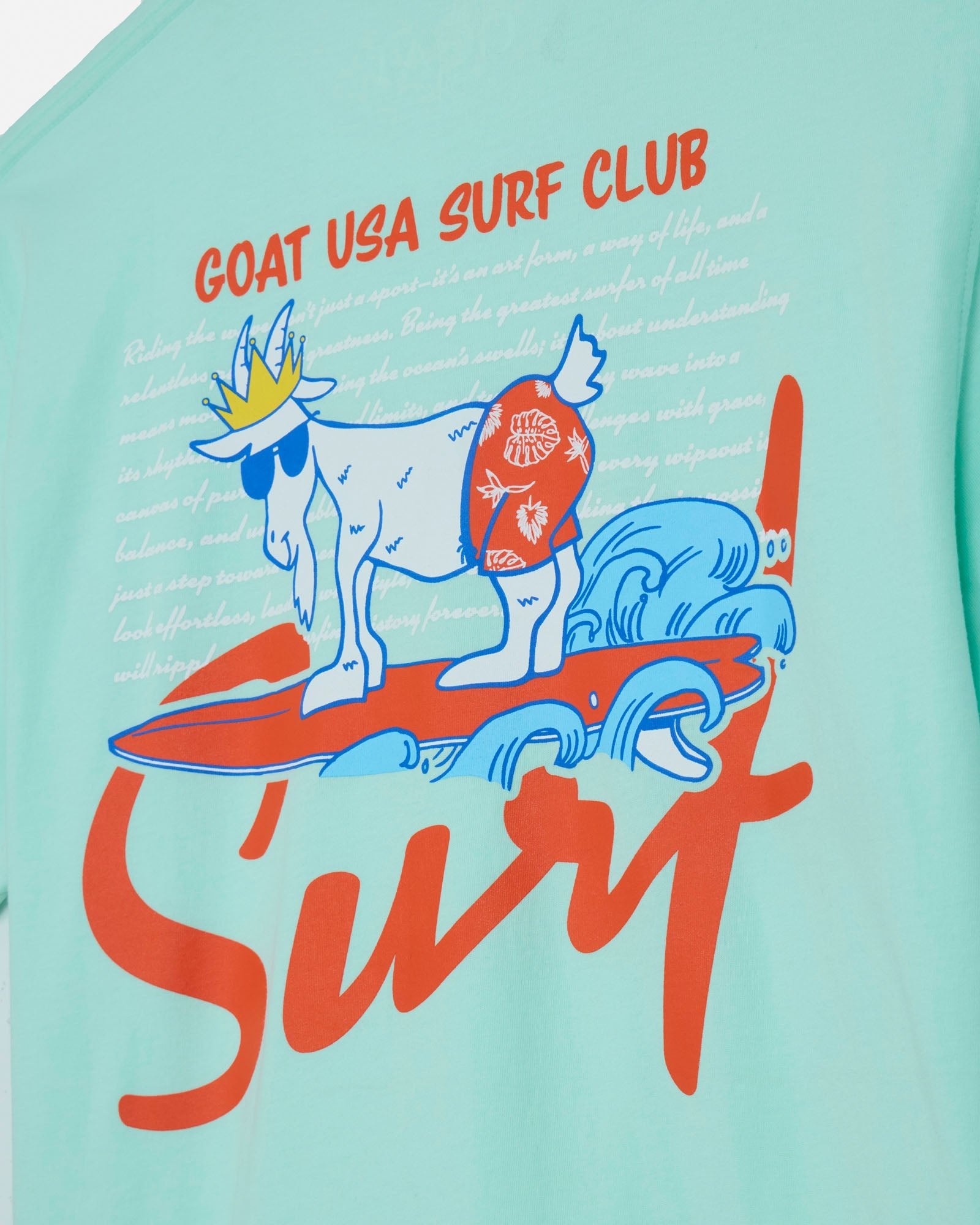Mint t-shirt with a goat surfing design and 'GOAT USA SURF CLUB' text.