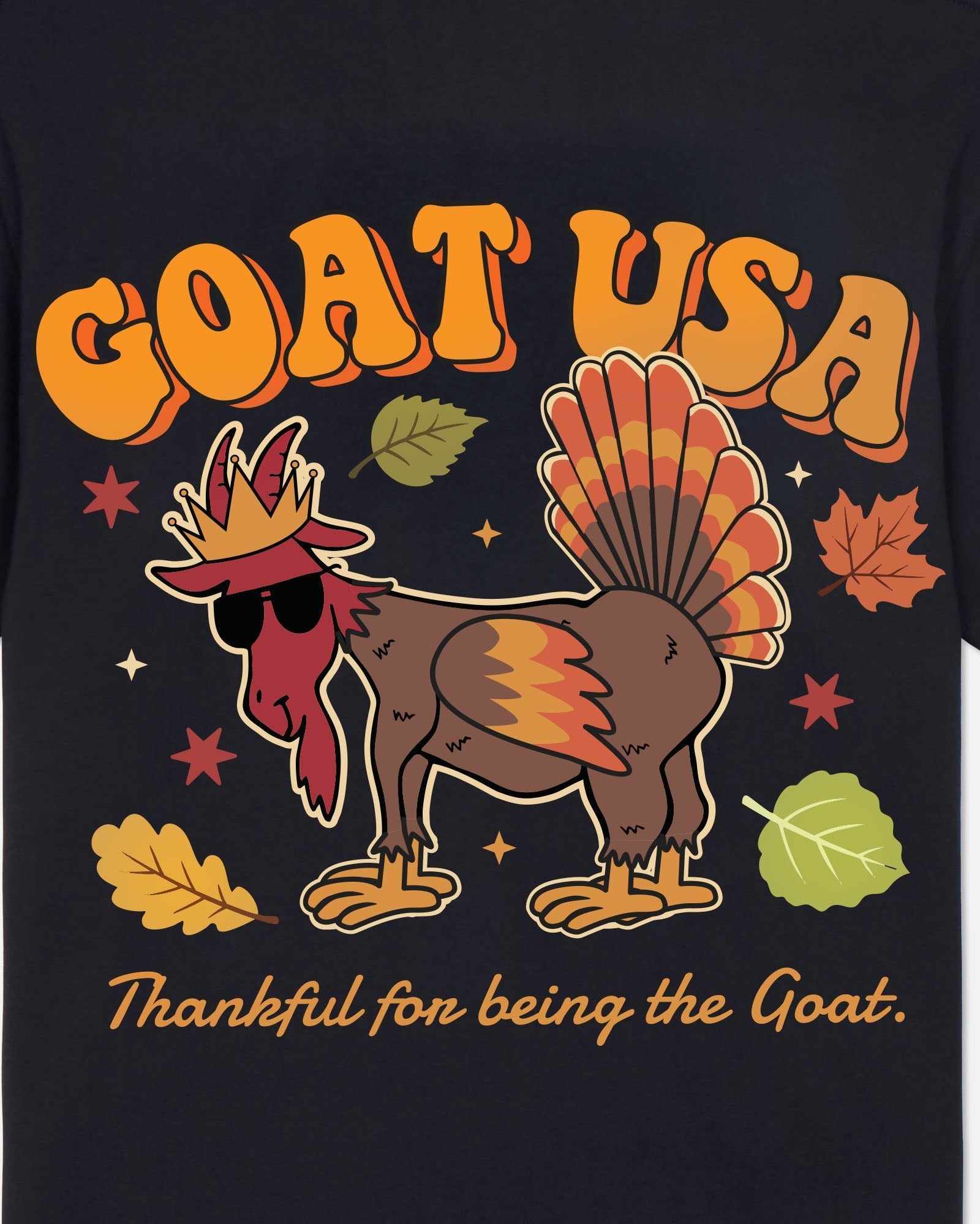 Black t-shirt with a cartoon turkey wearing a crown and sunglasses, surrounded by leaves and stars, with 'GOAT USA' and 'Thankful for being the Goat' text.